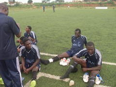 COACH OF NIMC FC DISCUSSING WITH HIS PLAYERS AT HALF TIME